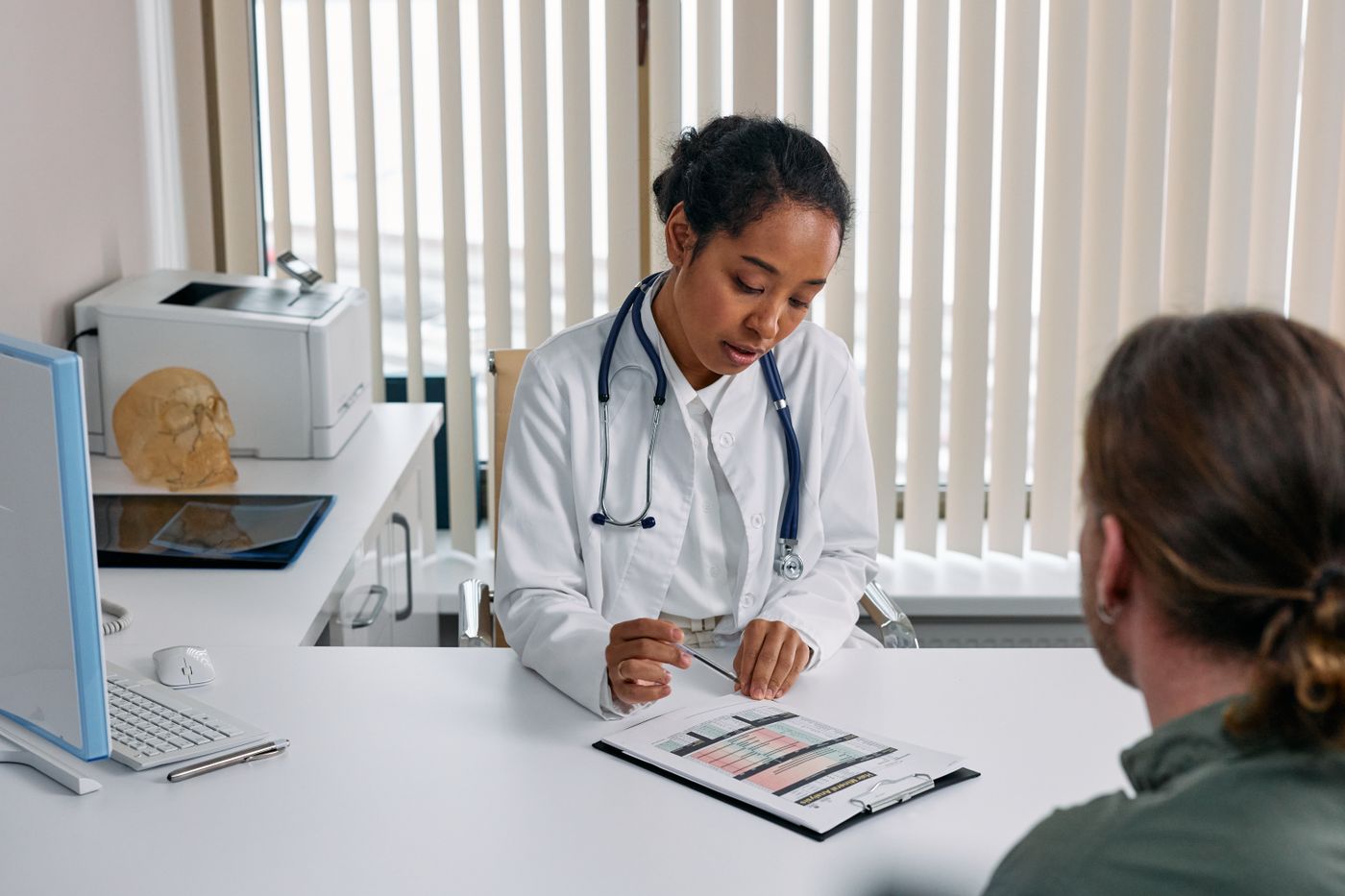 Helixa clinician sitting with a patient during a consultation